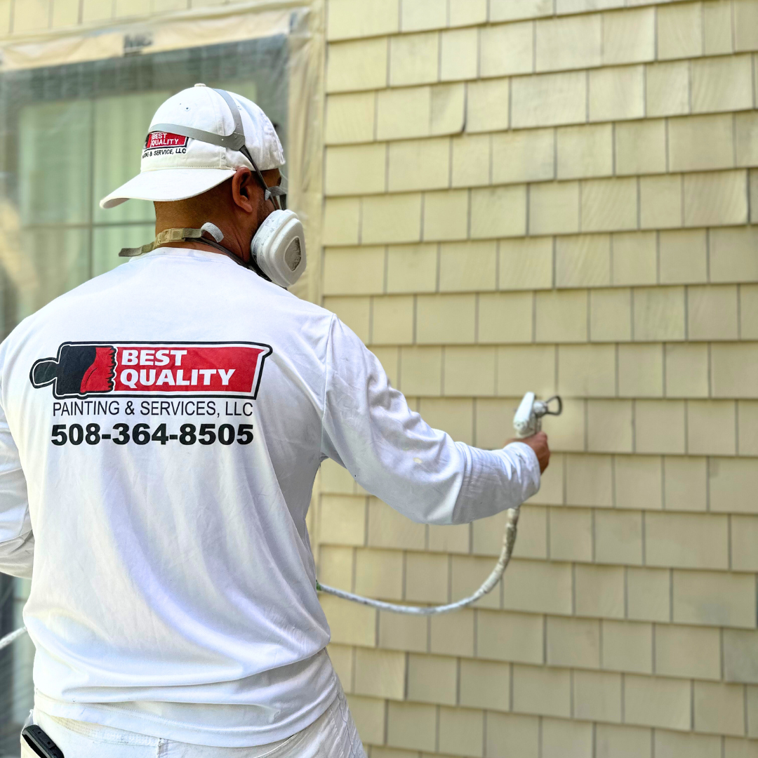 Professional painter applying fresh paint to an interior wall