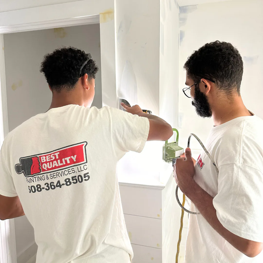 Professional interior painting with smooth roller application on a bright residential wall.
